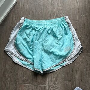 Blue athletic shorts with Johns Hopkins labeled on them